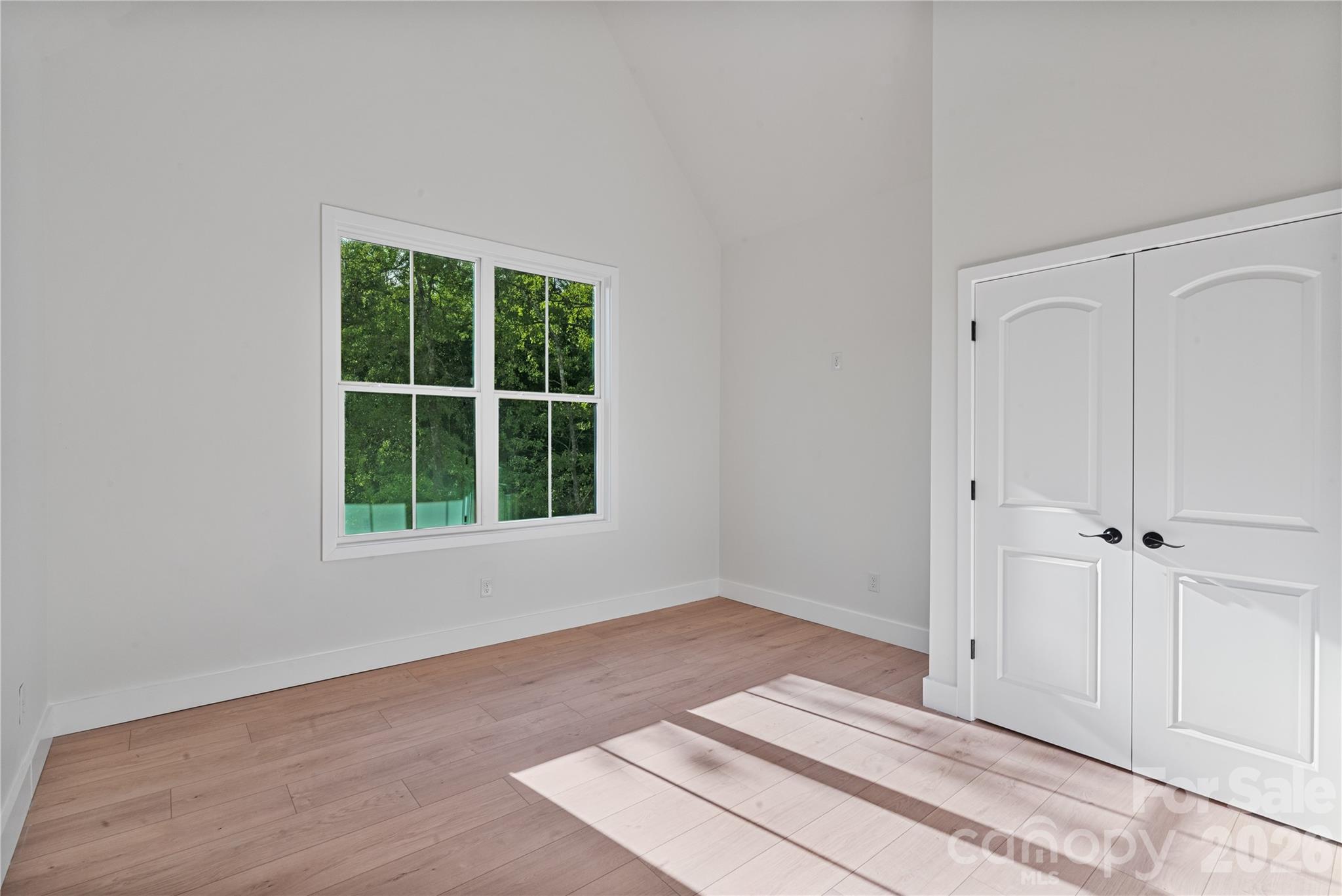 460 Riddle Mill Road Clover, SC 29710 - Photo 30 of 48 a view of an empty room with wooden floor and a window