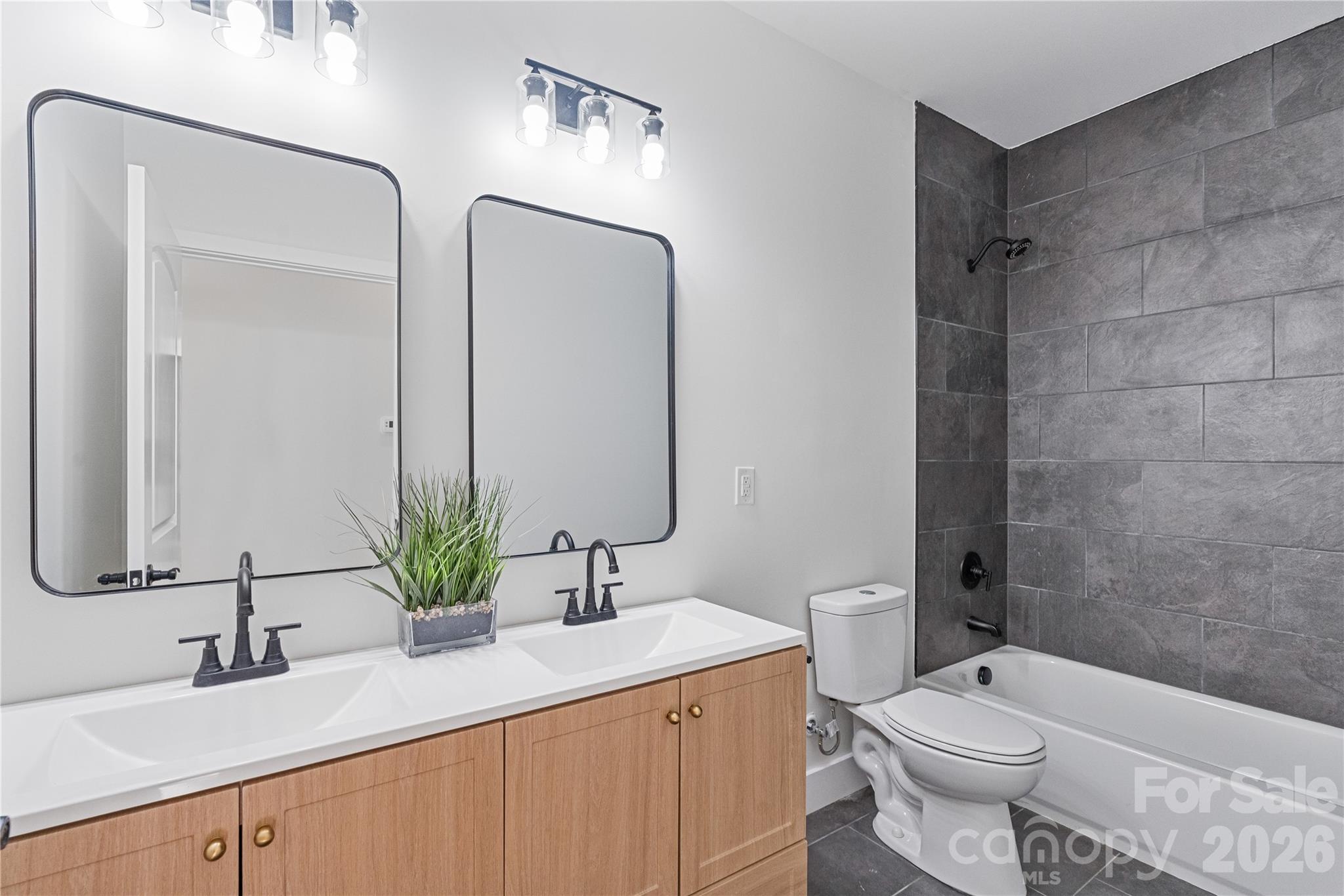 460 Riddle Mill Road Clover, SC 29710 - Photo 35 of 48 a bathroom with a double vanity sink toilet and mirror