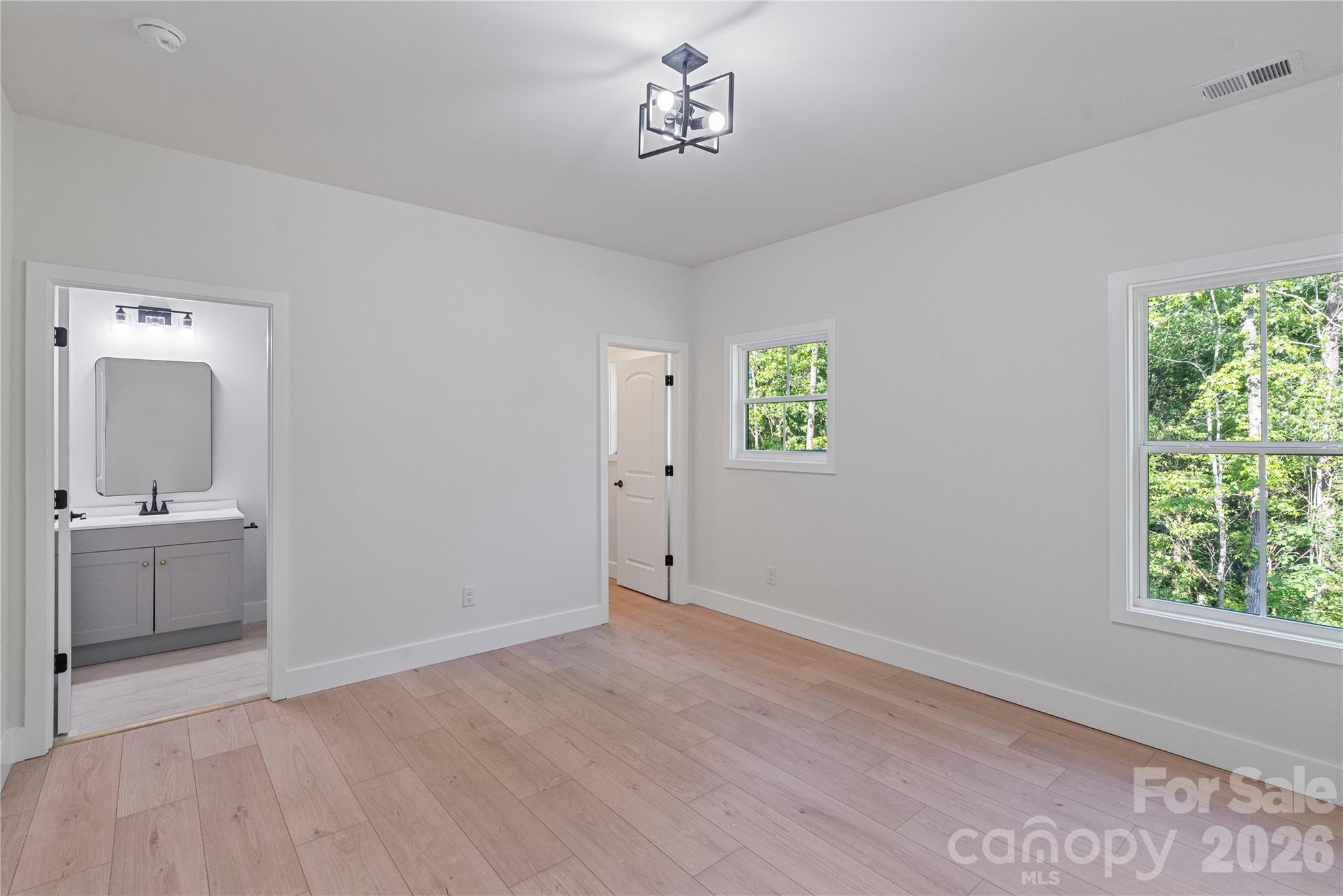 460 Riddle Mill Road Clover, SC 29710 - Photo 36 of 48 wooden floor in an empty room with a window