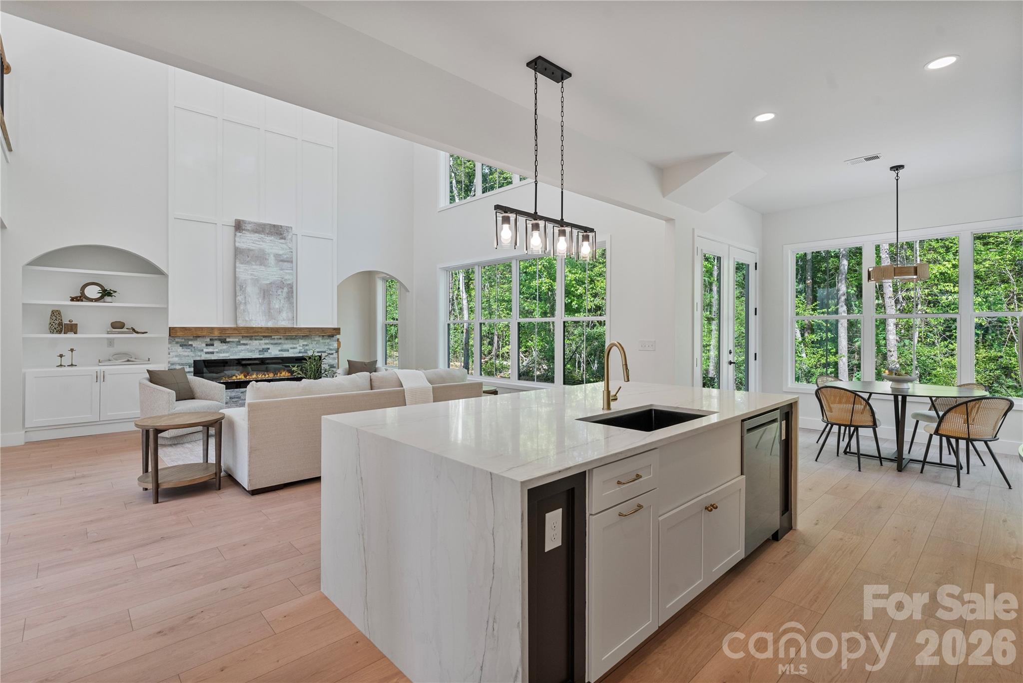 460 Riddle Mill Road Clover, SC 29710 - Photo 4 of 48 a kitchen with white cabinets and white appliances
