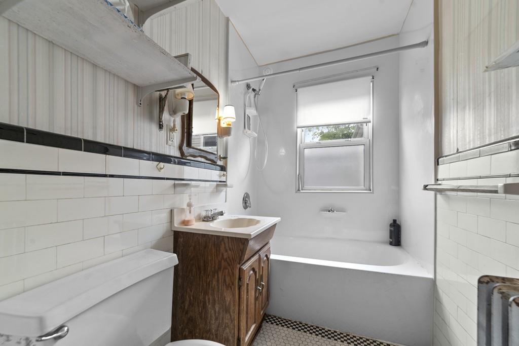 136 Fulton Spring Road Medford, MA 02155 - Photo 8 of 14 a bathroom with a sink a toilet and shower