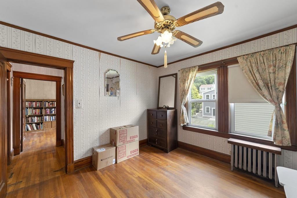 136 Fulton Spring Road Medford, MA 02155 - Photo 9 of 14 a view of livingroom with furniture wooden floor and fan