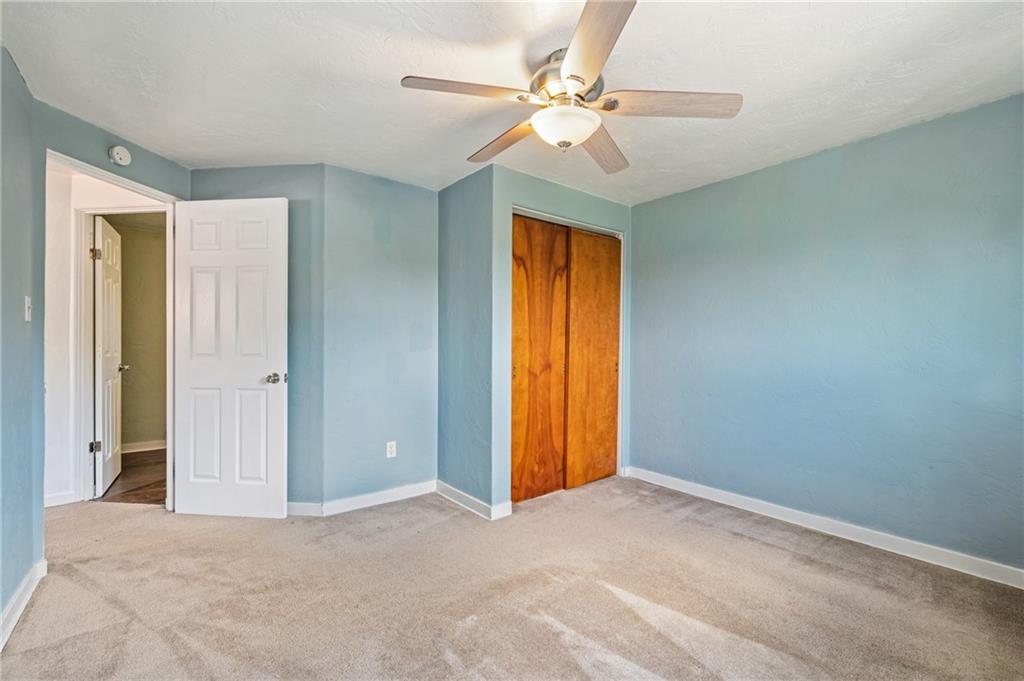 2106 Lappe Lane Pittsburgh, PA 15212 - Photo 12 of 20 a view of a big room with closet and a chandelier fan
