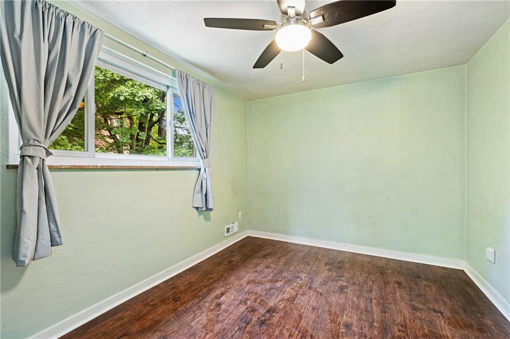2106 Lappe Lane Pittsburgh, PA 15212 - Photo 13 of 20 an empty room with a window and a ceiling fan