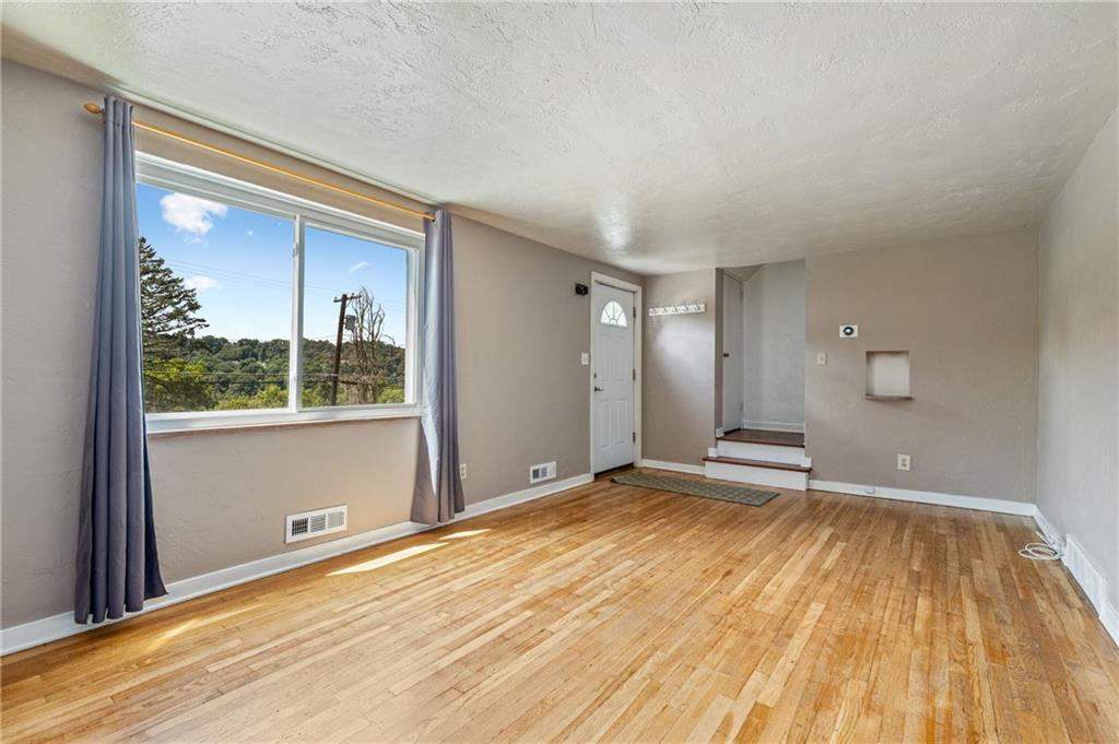 2106 Lappe Lane Pittsburgh, PA 15212 - Photo 2 of 20 a view of an empty room and window