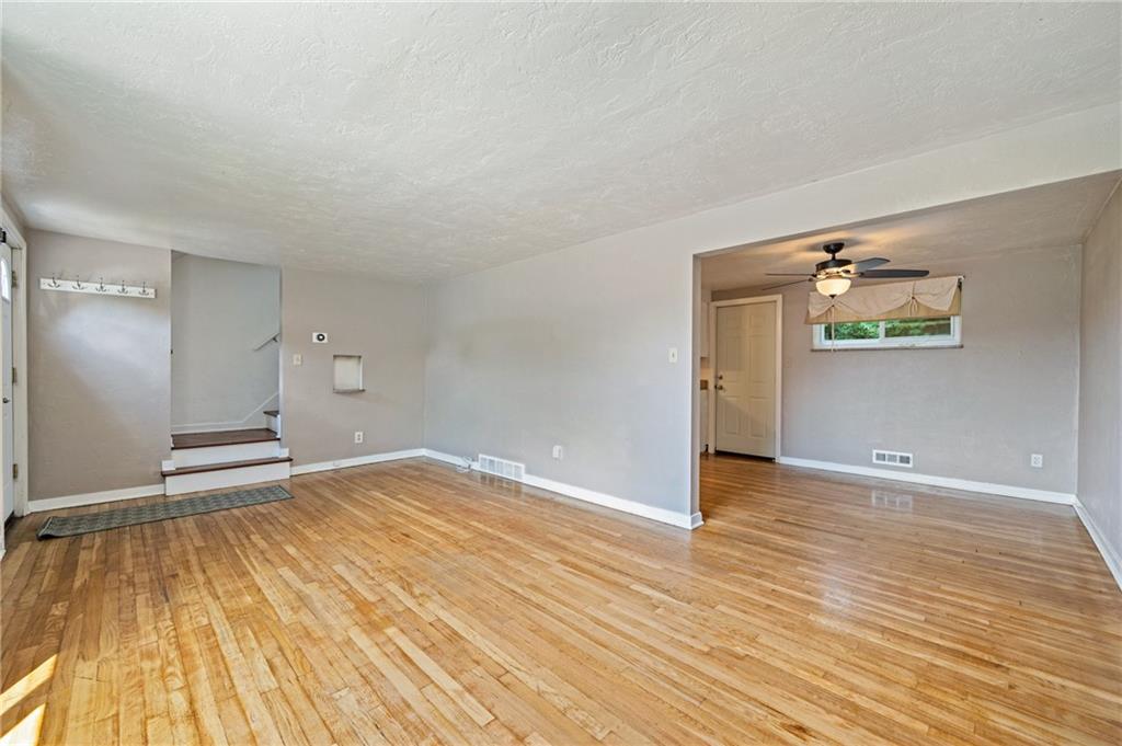 2106 Lappe Lane Pittsburgh, PA 15212 - Photo 3 of 20 a view of empty room with wooden floor and fan