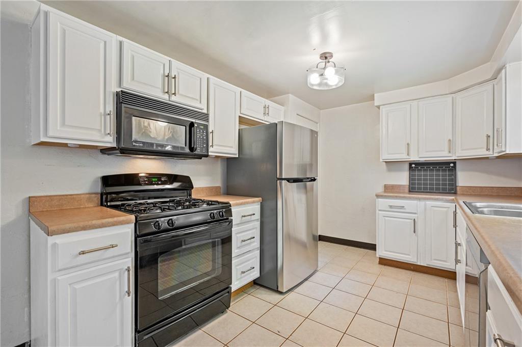 2106 Lappe Lane Pittsburgh, PA 15212 - Photo 6 of 20 a kitchen with cabinets stainless steel appliances and a counter space