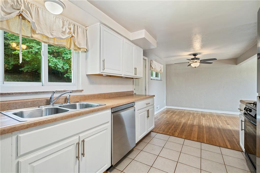 2106 Lappe Lane Pittsburgh, PA 15212 - Photo 7 of 20 a kitchen with a sink and cabinets
