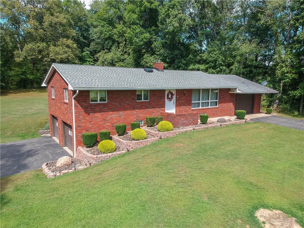 a front view of a house with garden