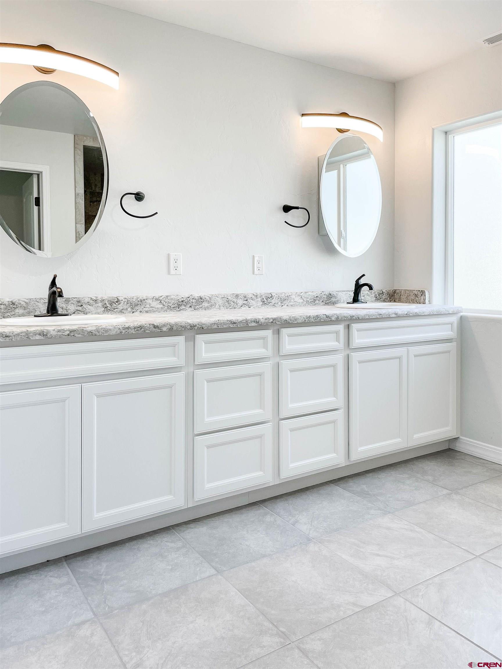554 A Street Delta, CO 81416 - Photo 21 of 33 a bathroom with a sink and a mirror