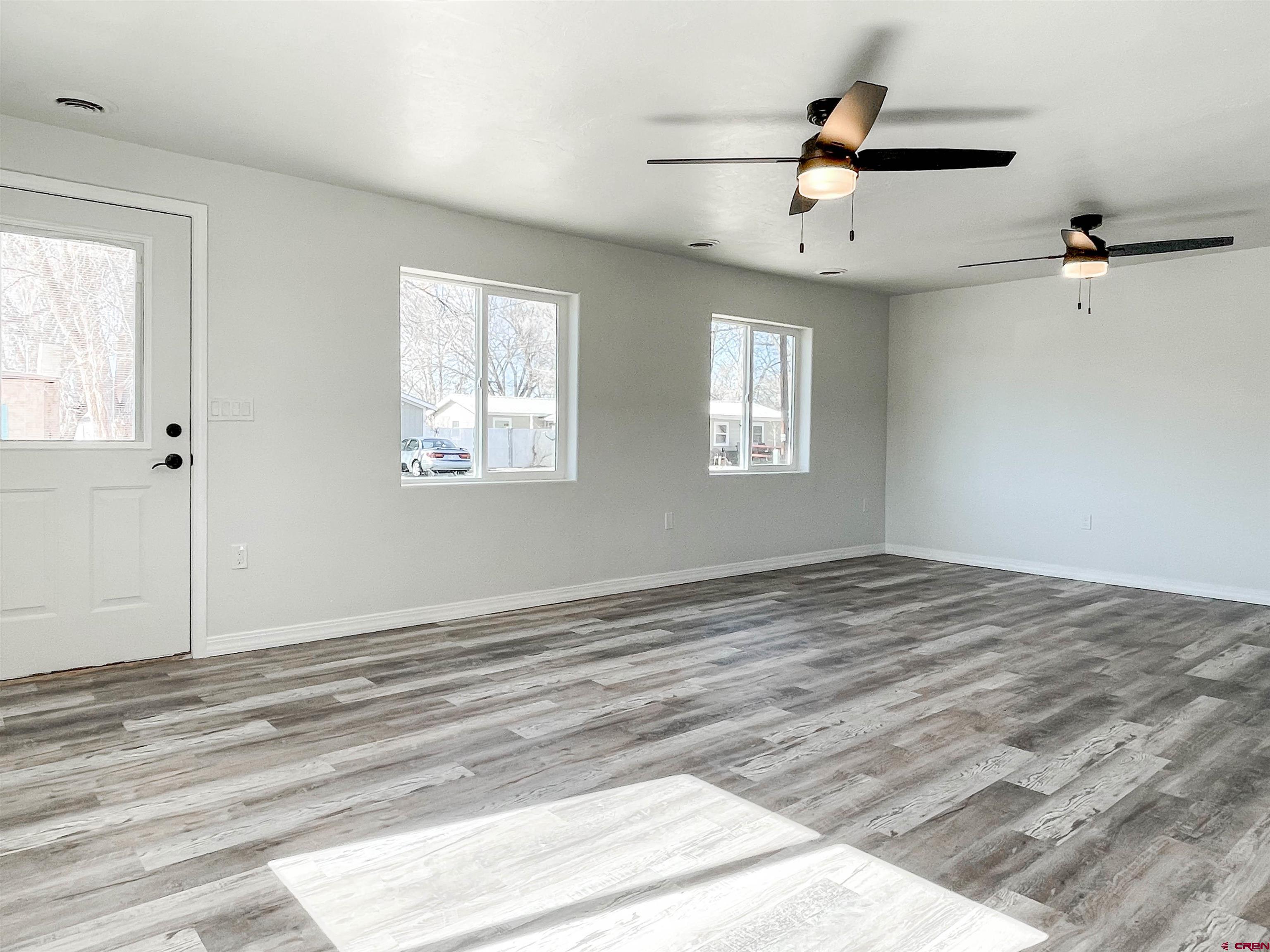 554 A Street Delta, CO 81416 - Photo 5 of 33 a view of empty room with wooden floor and fan
