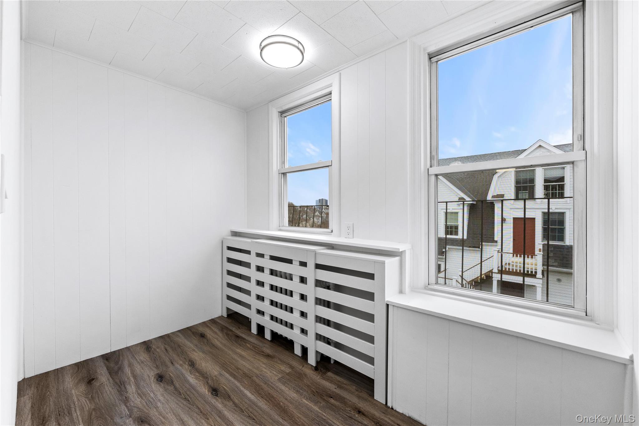 3 Harbor Lane, Unit 3A New Rochelle, NY 10805 - Photo 14 of 16 a view of wooden floor and windows in a room