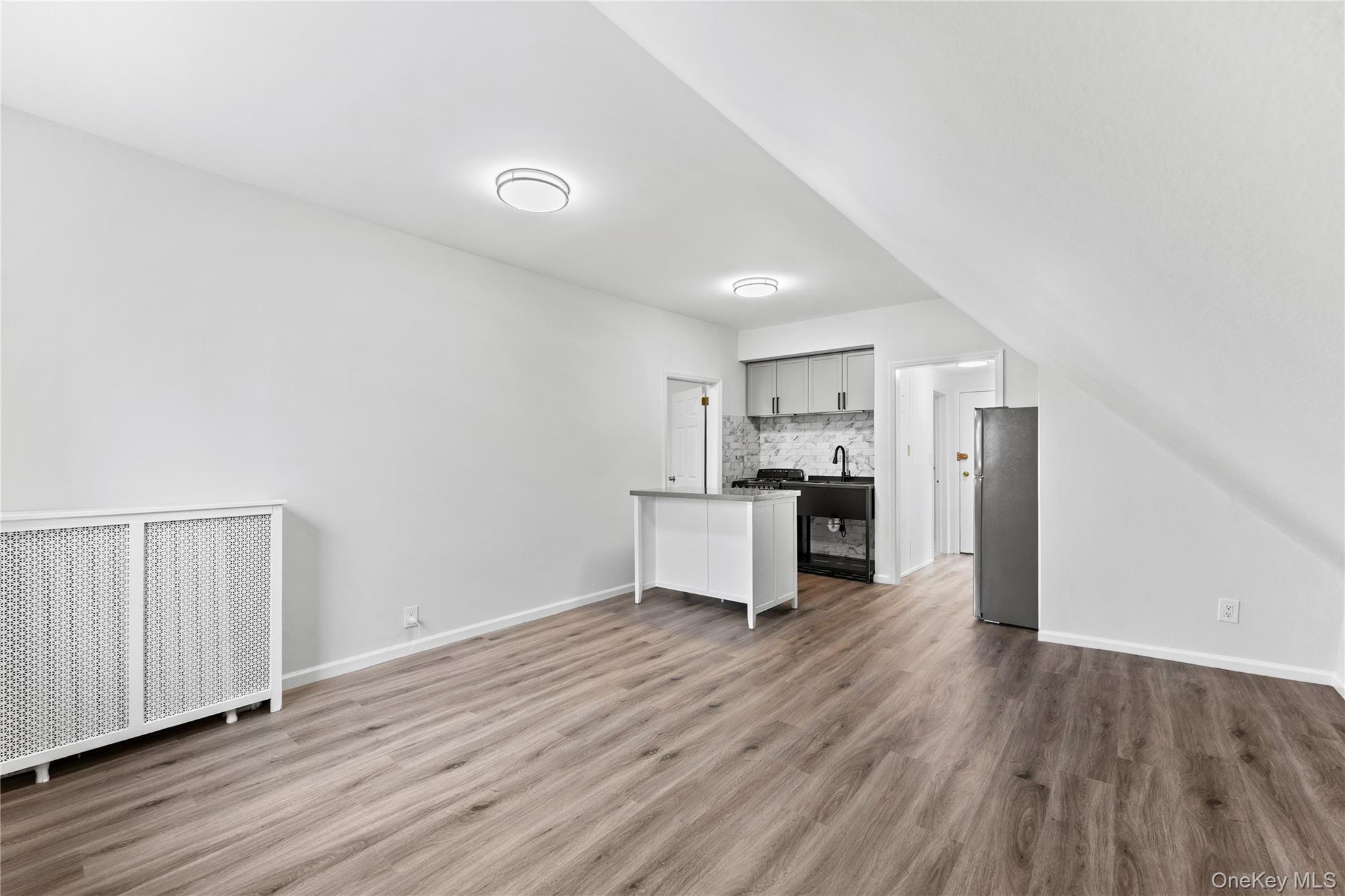3 Harbor Lane, Unit 3A New Rochelle, NY 10805 - Photo 5 of 16 a view of kitchen and wooden floor