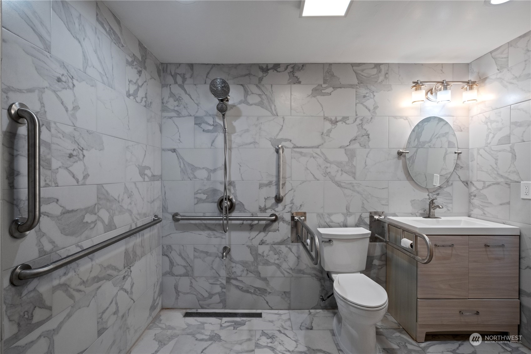 Undisclosed Address Bellevue, WA 98008 - Photo 16 of 28 a bathroom with a sink toilet and shower