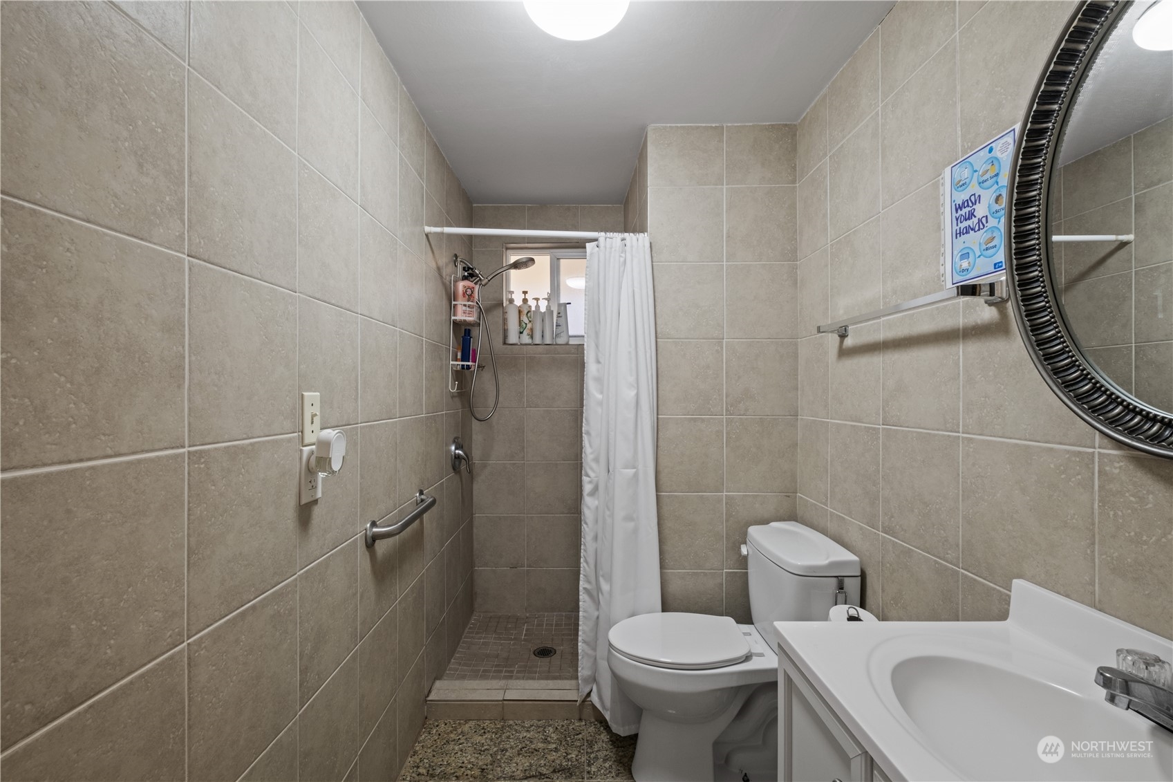 Undisclosed Address Bellevue, WA 98008 - Photo 18 of 28 a bathroom with a sink toilet and shower