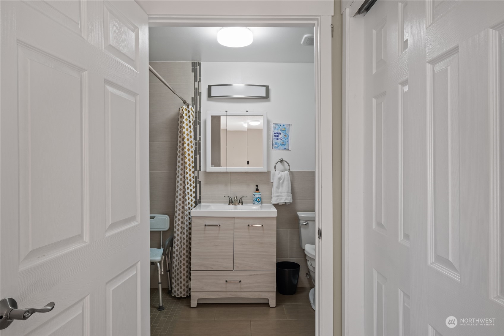 Undisclosed Address Bellevue, WA 98008 - Photo 20 of 28 a bathroom with a sink a toilet and shower