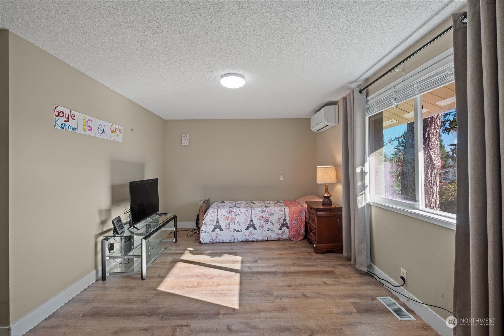 Undisclosed Address Bellevue, WA 98008 - Photo 21 of 28 a living room with furniture and a flat screen tv