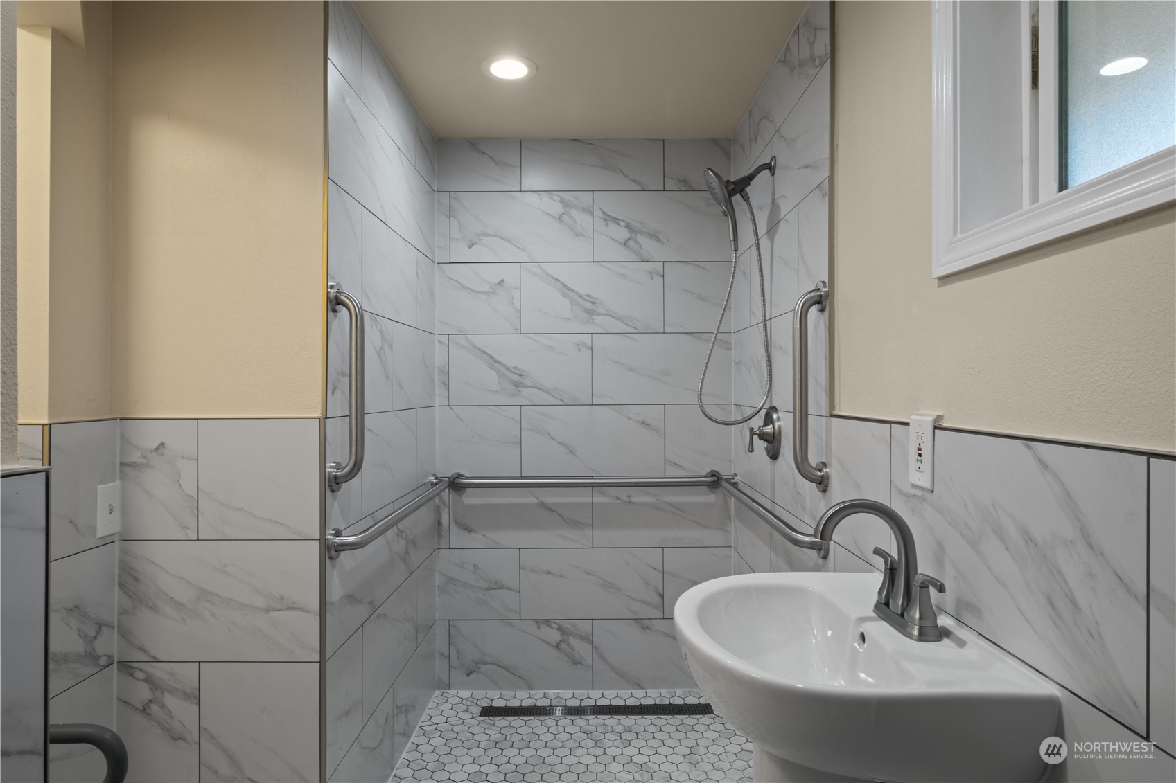 Undisclosed Address Bellevue, WA 98008 - Photo 23 of 28 a bathroom with a sink and shower