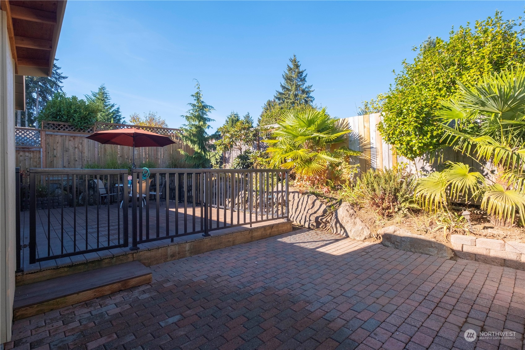 Undisclosed Address Bellevue, WA 98008 - Photo 28 of 28 a view of a yard with wooden fence