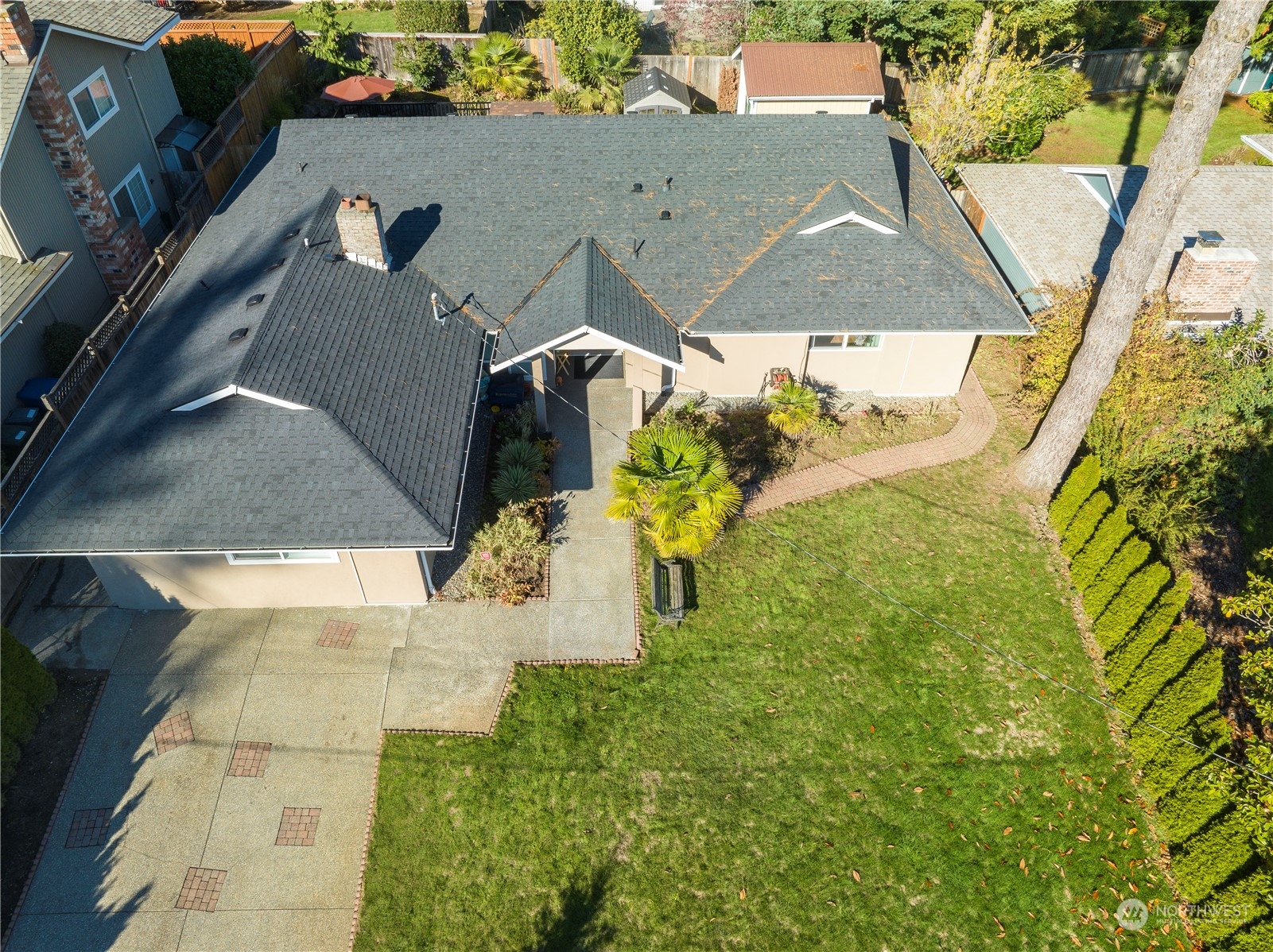 Undisclosed Address Bellevue, WA 98008 - Photo 4 of 28 an aerial view of a house with a yard
