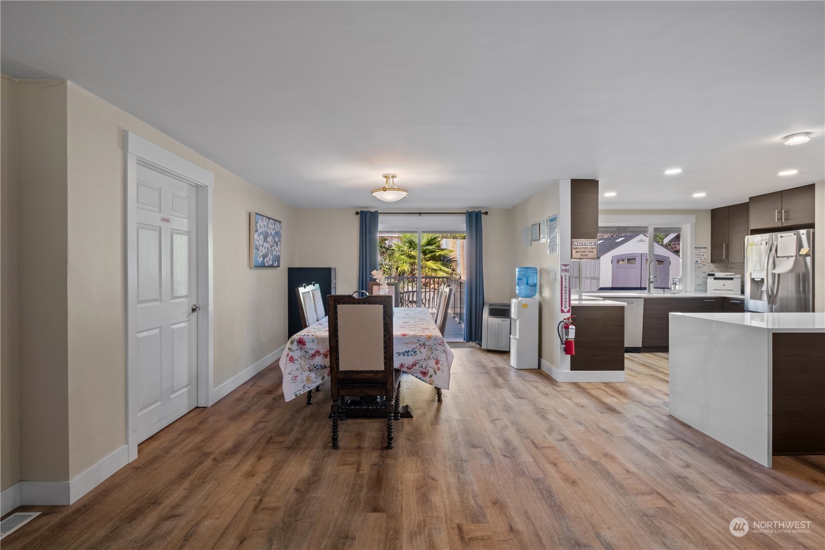 Undisclosed Address Bellevue, WA 98008 - Photo 10 of 28 a living room with furniture and a wooden floor
