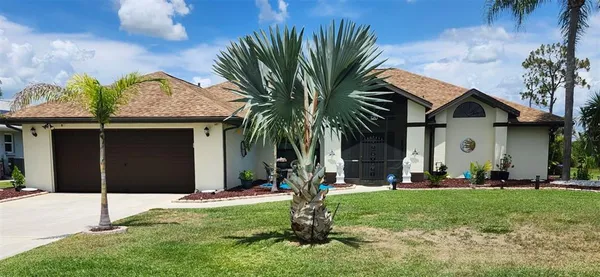 a front view of house with yard and green space