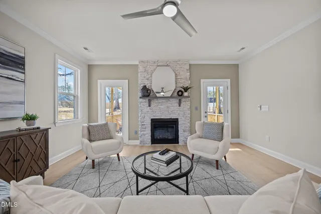 a living room with furniture and a fireplace