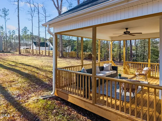a yellow house with trees in front of it