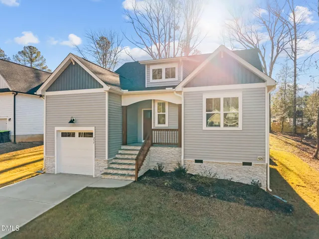 a view of a house with a large window and stairs