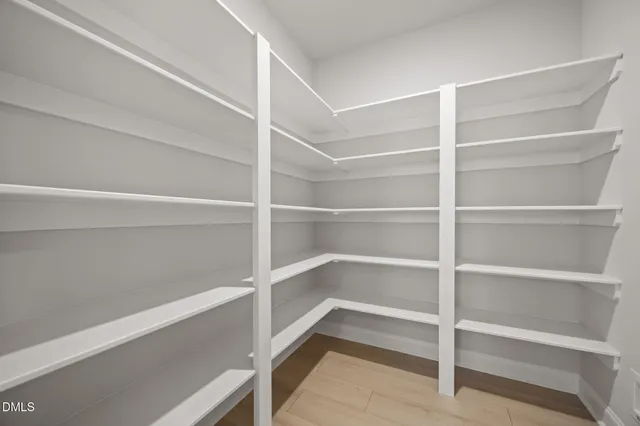 a kitchen with kitchen island a dining table and chairs