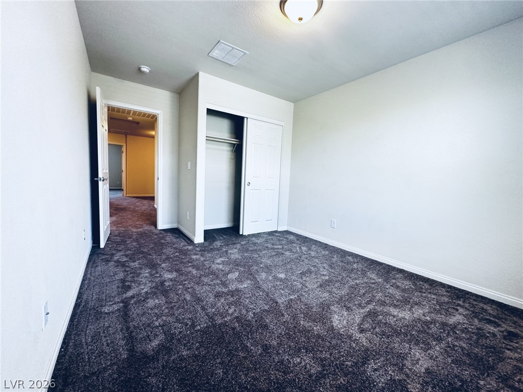 7331 Sunray Point Street North Las Vegas, NV 89084 - Photo 8 of 20 A well-lit room offers fresh carpeting and a spacious closet.