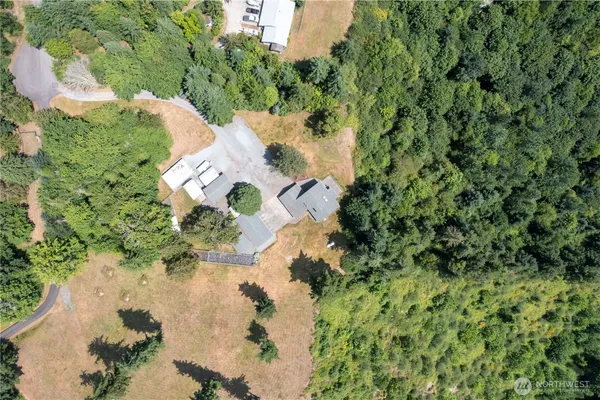 an aerial view of a house with a yard