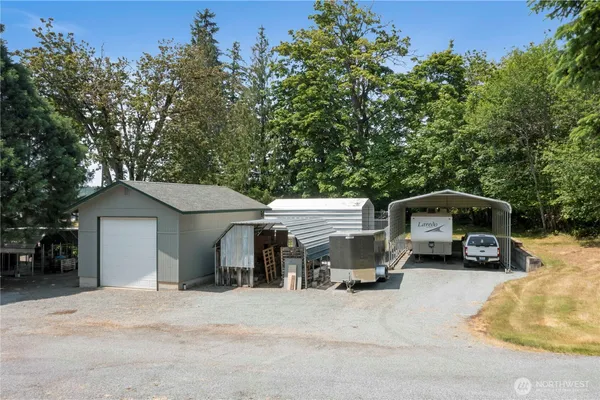 a kitchen with stainless steel appliances granite countertop a refrigerator a sink a stove and island