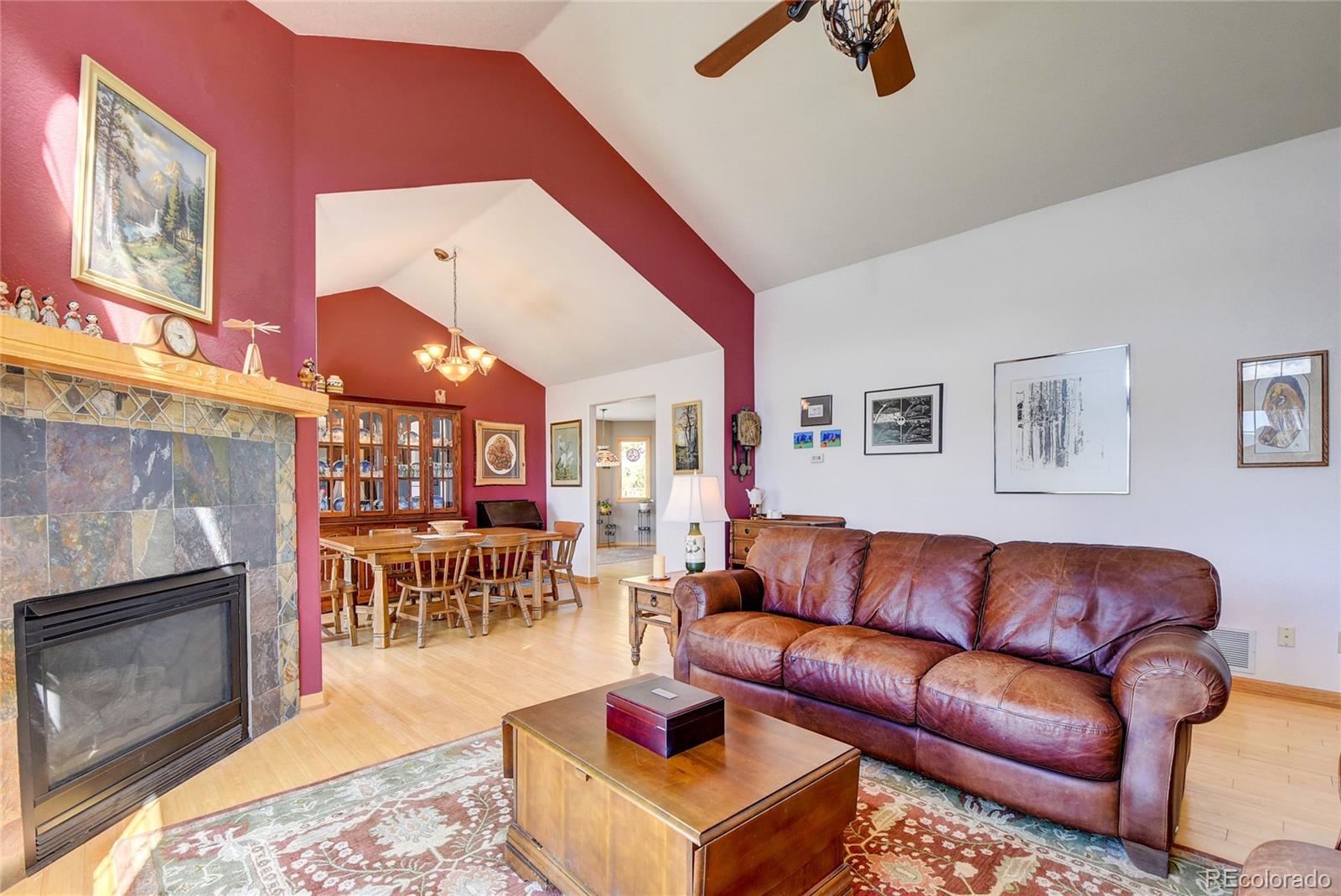 33633 Elk Run Evergreen, CO 80439 - Photo 11 of 40 a living room with furniture and a fireplace
