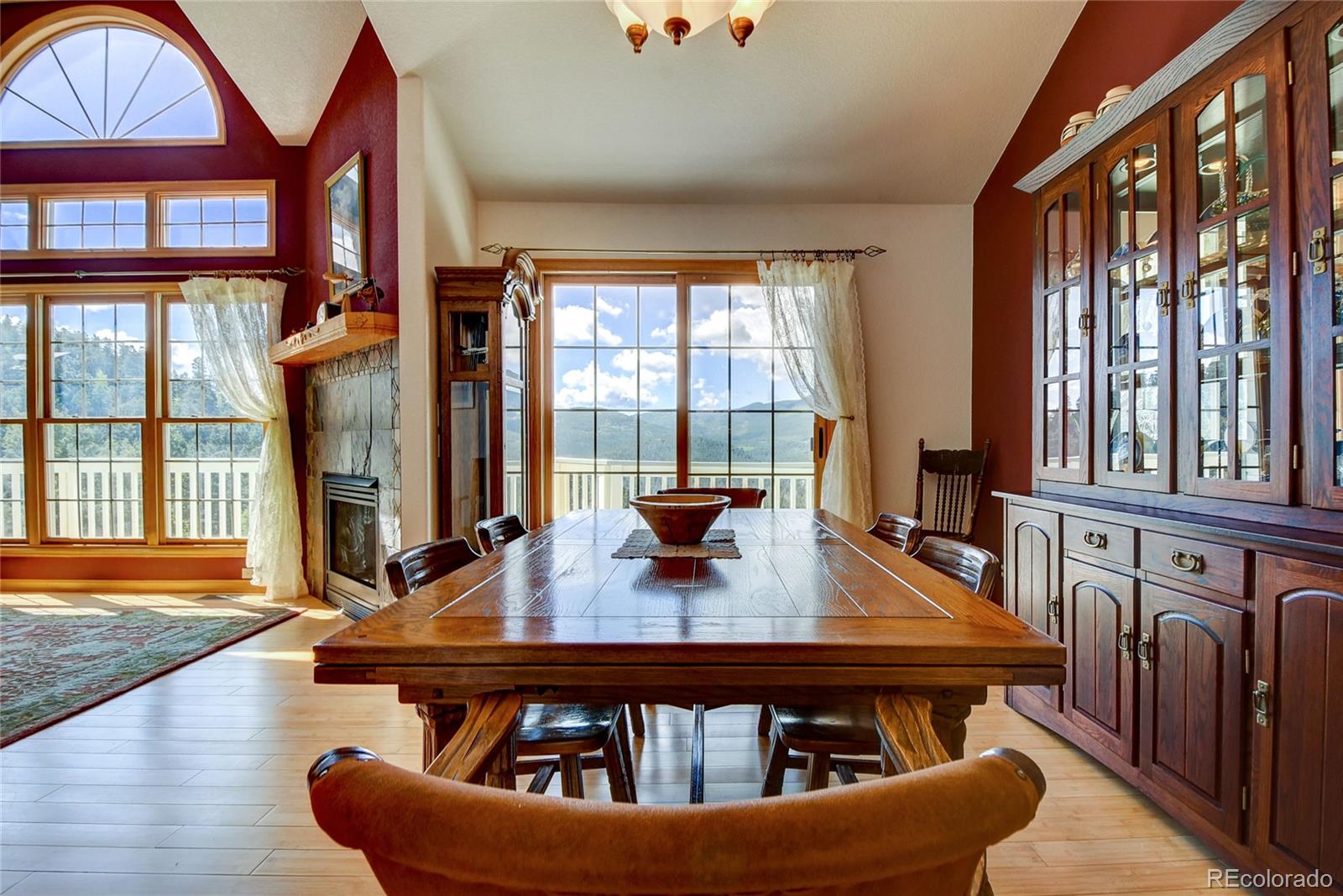 33633 Elk Run Evergreen, CO 80439 - Photo 13 of 40 a living room with furniture a table and large windows