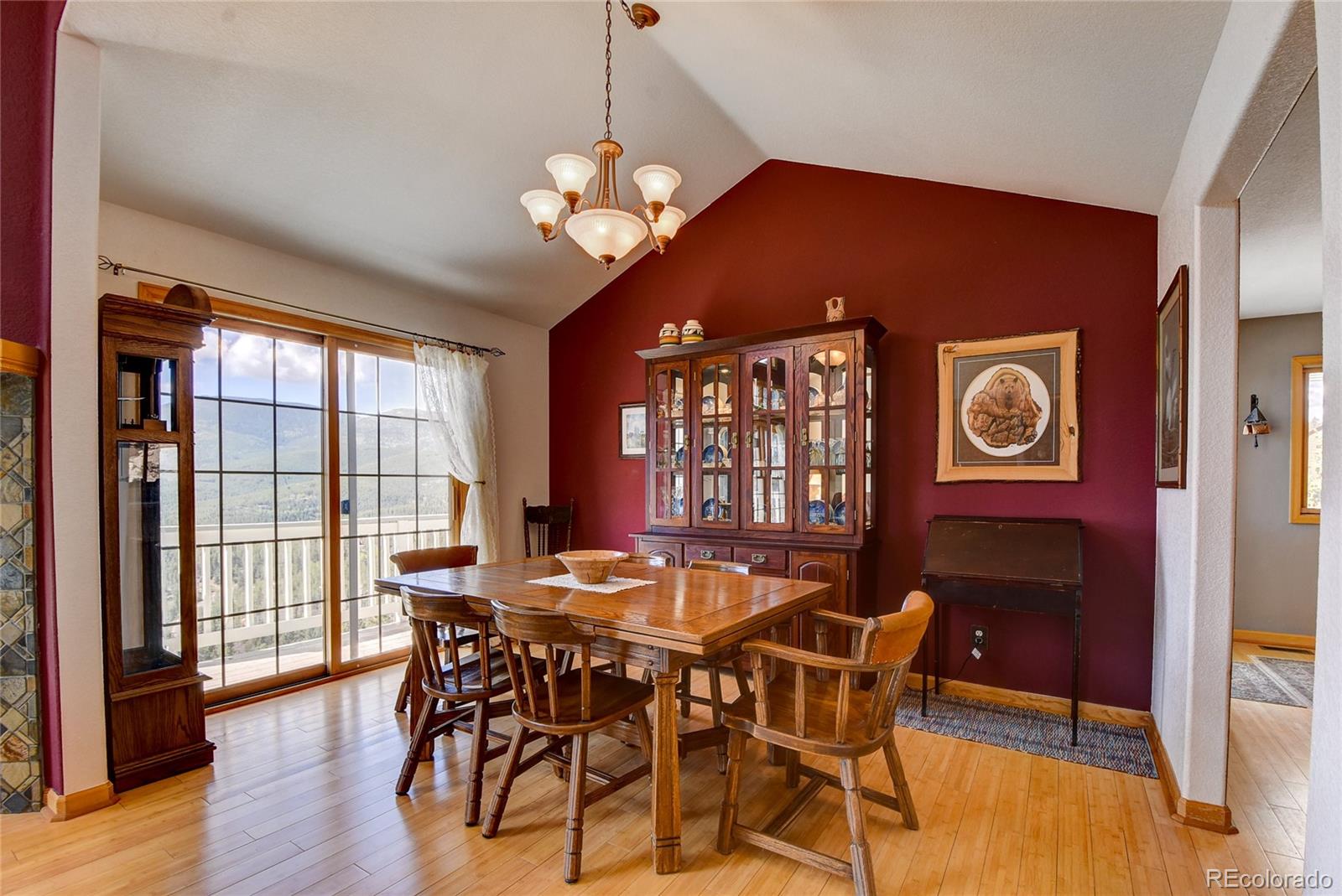 33633 Elk Run Evergreen, CO 80439 - Photo 14 of 40 a view of a dining room with furniture window and wooden floor