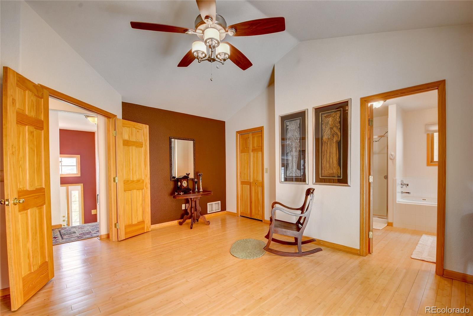 33633 Elk Run Evergreen, CO 80439 - Photo 18 of 40 a view of a livingroom with wooden floor and a large window