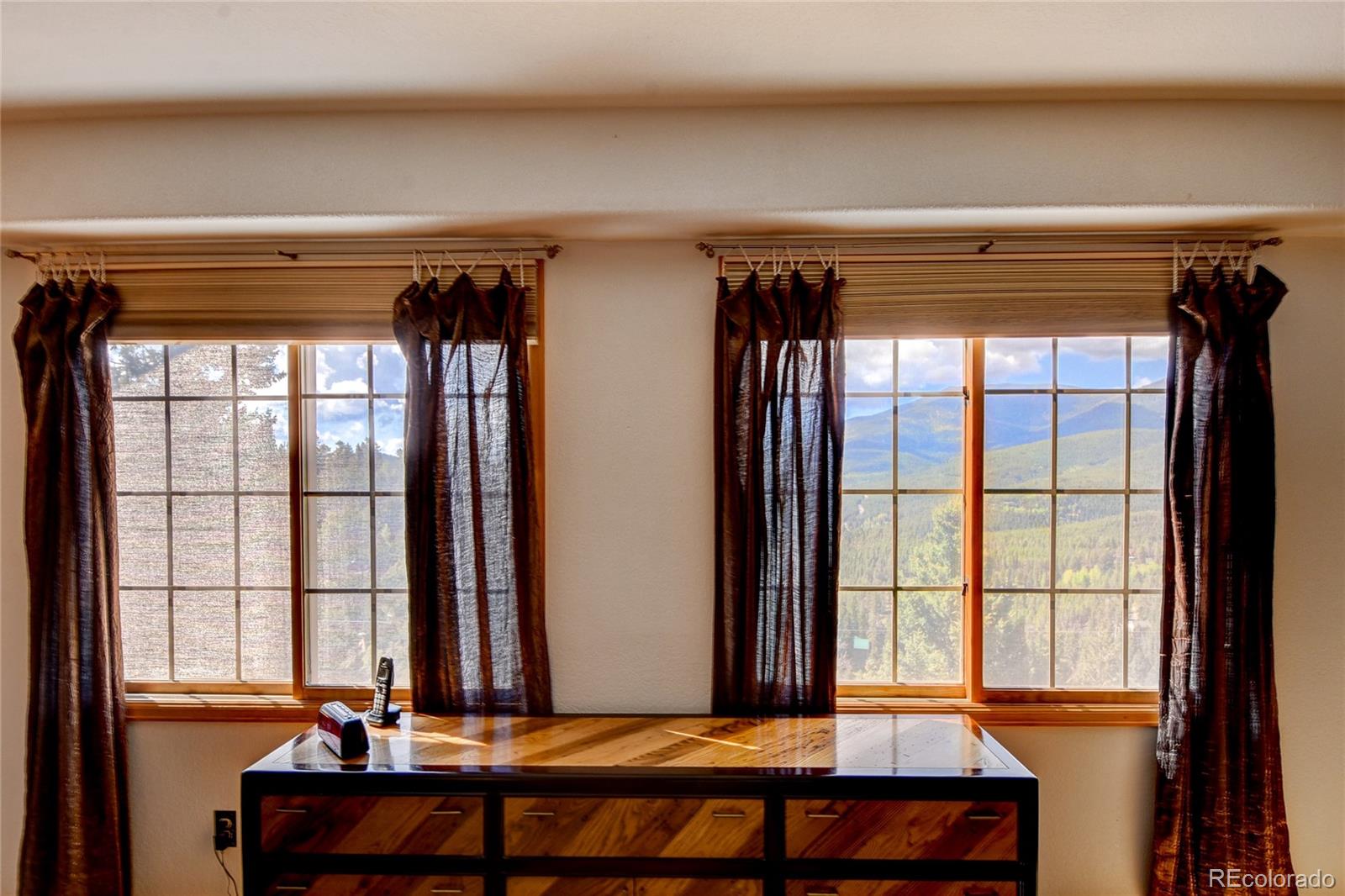 33633 Elk Run Evergreen, CO 80439 - Photo 23 of 40 a view of room with large windows and furniture