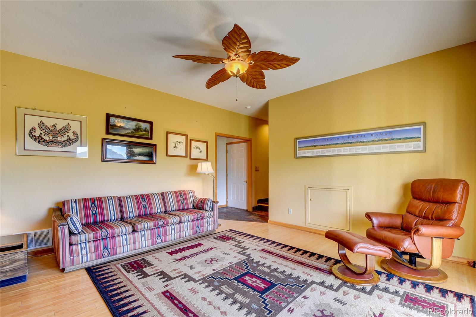 33633 Elk Run Evergreen, CO 80439 - Photo 29 of 40 a living room with furniture and wooden floor