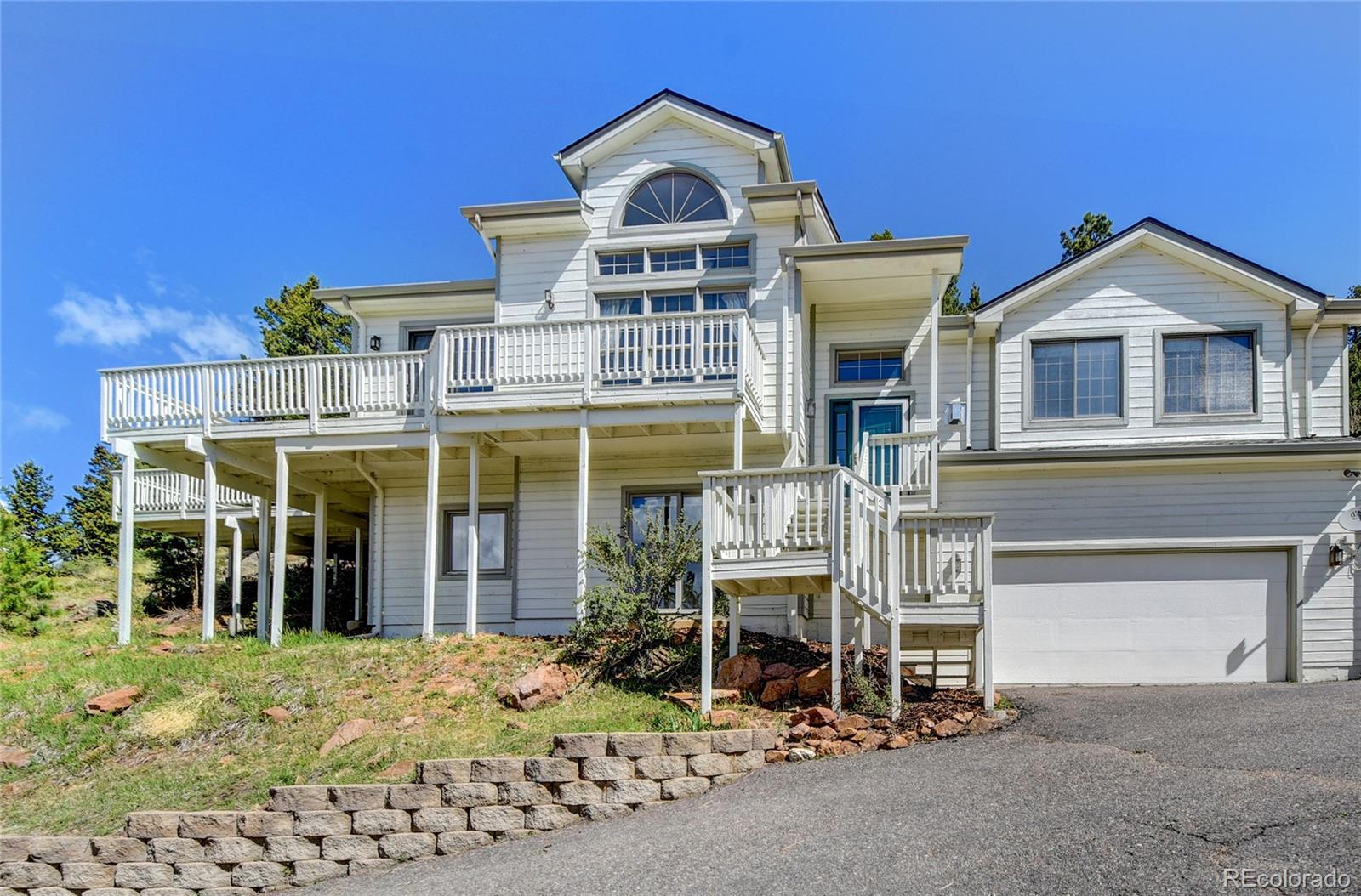 33633 Elk Run Evergreen, CO 80439 - Photo 33 of 40 front view of a house with a porch