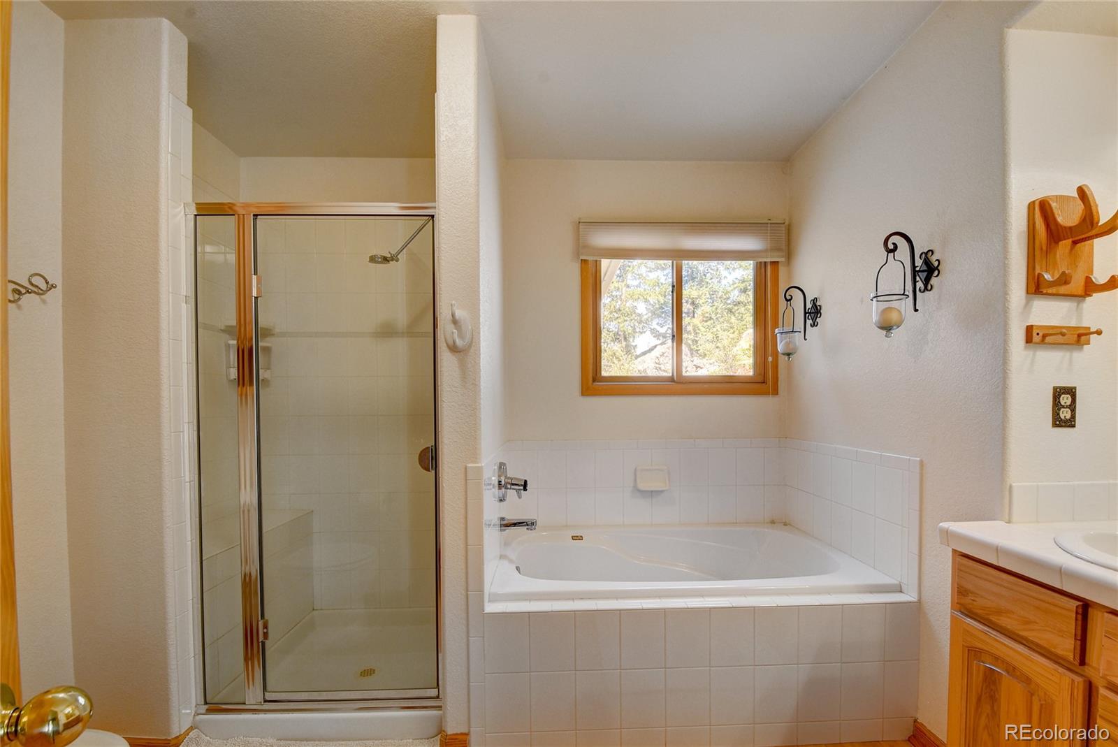 33633 Elk Run Evergreen, CO 80439 - Photo 34 of 40 a white bath tub sitting next to a white sink