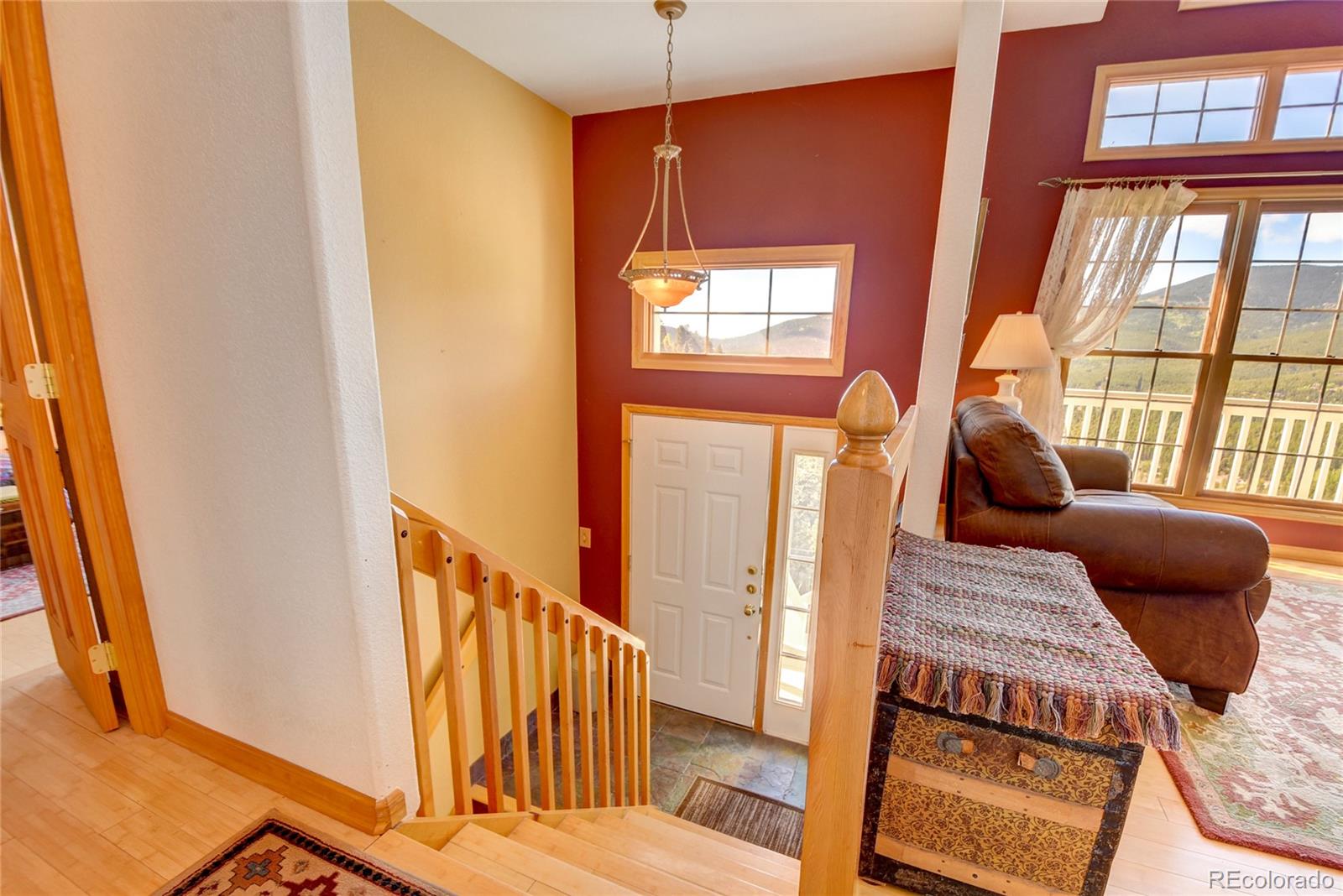 33633 Elk Run Evergreen, CO 80439 - Photo 8 of 40 a bedroom with window and furniture