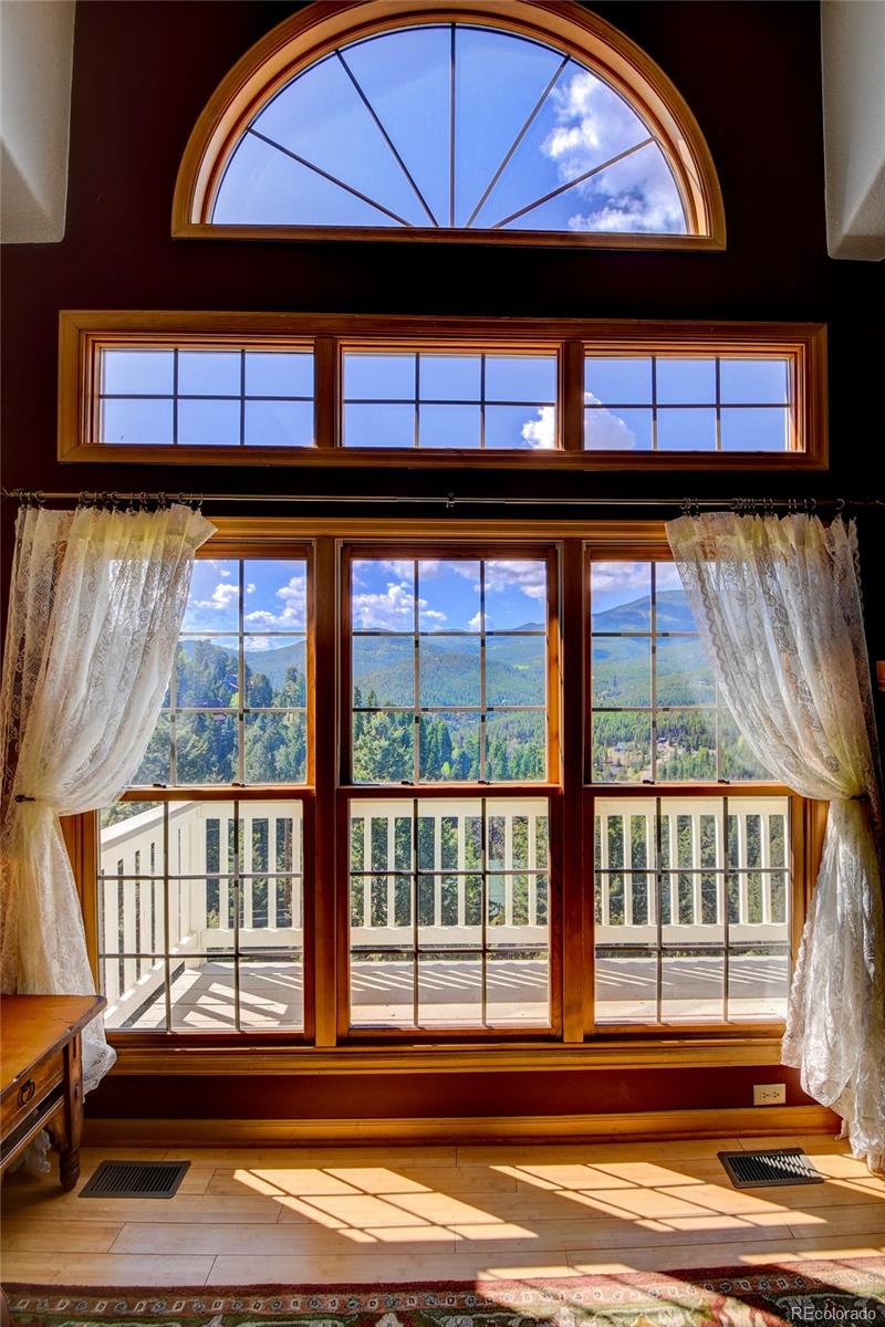 33633 Elk Run Evergreen, CO 80439 - Photo 9 of 40 a view of front door of house with a street