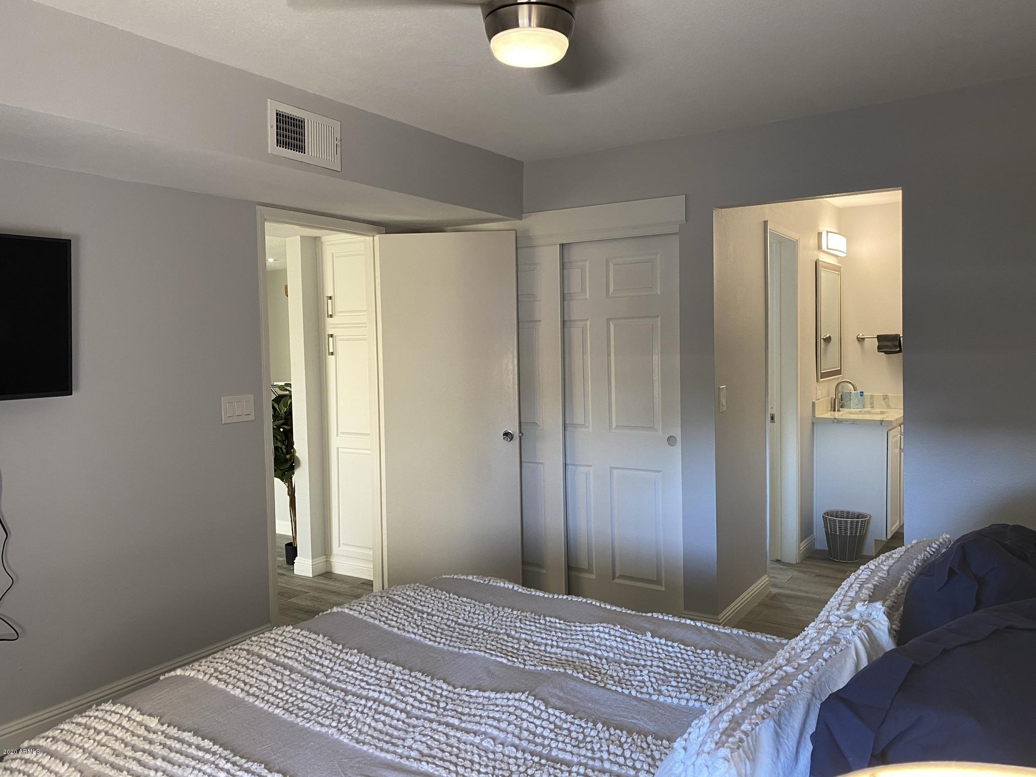 8055 East Thomas Road, Unit C109 Scottsdale, AZ 85251 - Photo 15 of 35 Bedroom to Living Room