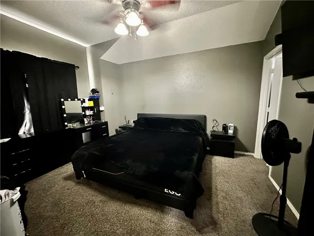 a bed room with a bed furniture and a mirror