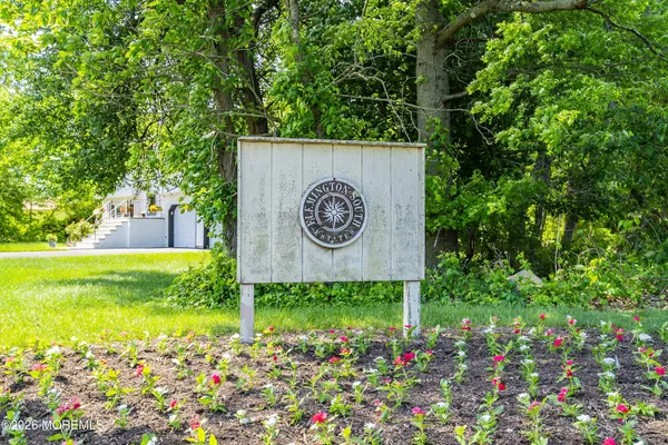 a view of a sign board with a park