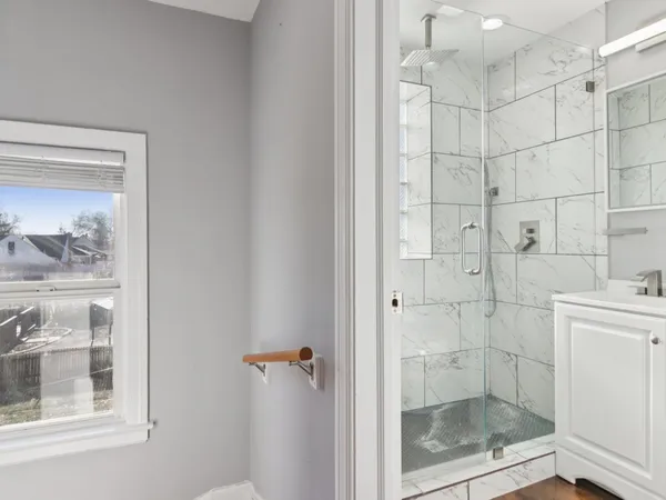 a bathroom with a toilet sink and shower