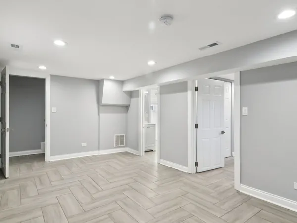 a bathroom with a shower a toilet and sink