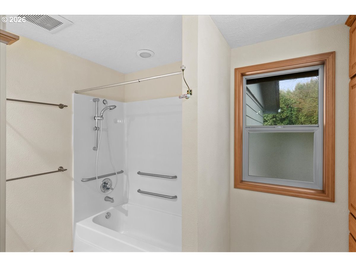 997 Julie Street North Keizer, OR 97303 - Photo 19 of 30 a bathroom with a window sink and shower