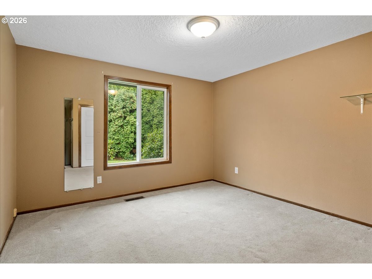 997 Julie Street North Keizer, OR 97303 - Photo 20 of 30 a view of an empty room with a window
